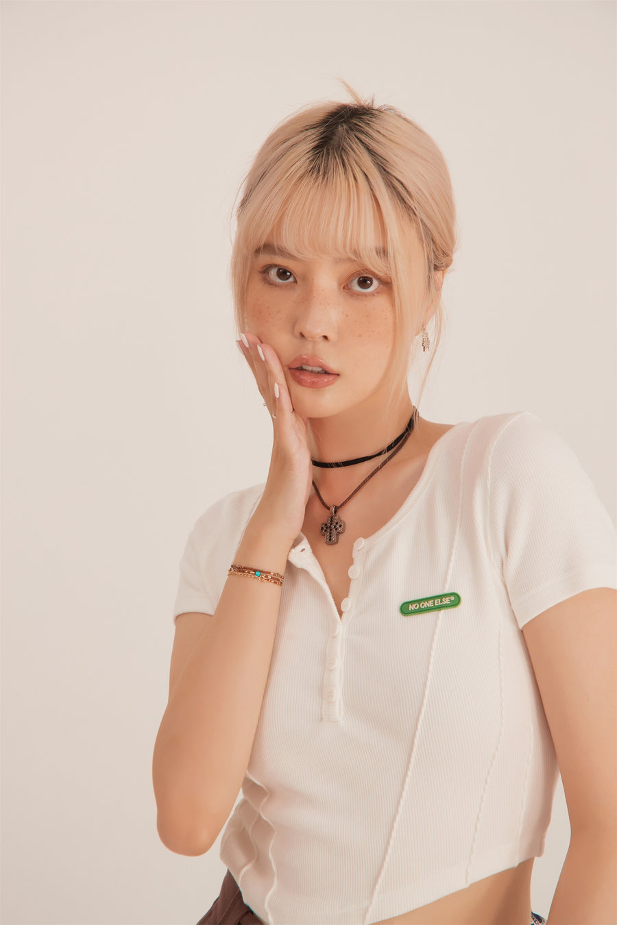 CHUU Unbalanced Button Crop Top